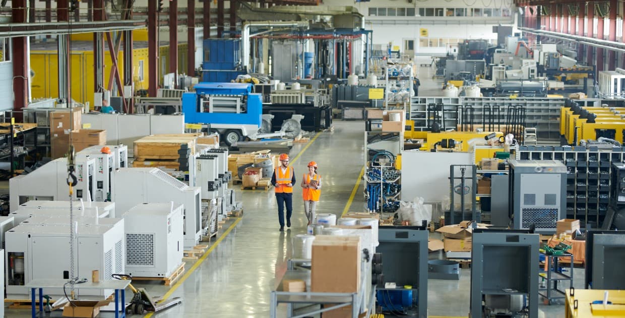 people-walking-through-manufacturing-building